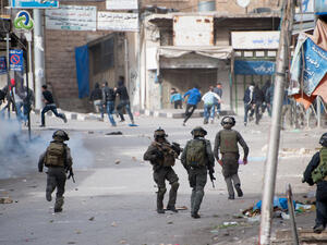  Israeli forces chase Palestinians (Shutterstock)