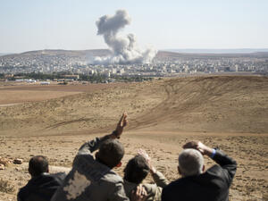 Smoke rises in Syria, after an airstrike (Shutterstock)	