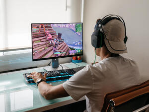 Teenager playing Fortnite video game (Shutterstock)