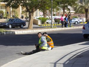 Construction workers resting on the street at lunchtime (Shutterstock)
