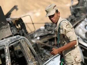An Egyptian soldier stands guard in an ongoing military operation against militants in the restive Sinai Peninsula (AFP/File Photo) An Egyptian soldier stands guard in an ongoing military operation against militants in the restive Sinai Peninsula (AFP/File Photo)