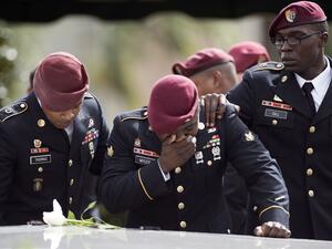 Comrades of Sgt La David Johnson cry at his burial service on 21 October in Hollywood, Florida. Johnson and three other US soldiers were killed in Niger on 4 October. (Gaston de Cardenas/AFP) 
