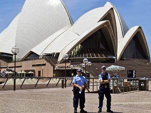 Security officers stand outside the Sydney Opera House. (AFP/File)