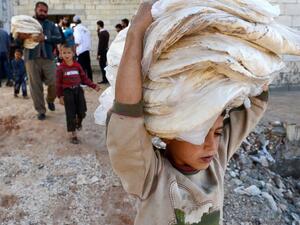 The Humanitarian Relief Foundation said it produces about 200,000 loaves of bread a day for Syrians. (AFP/File)