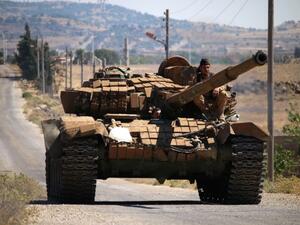 A rebel tank in Quneitra (AFP/FILE)