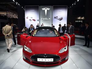 More than 3 million people worldwide visit Tesla retail stores every year. (AFP/ File)
