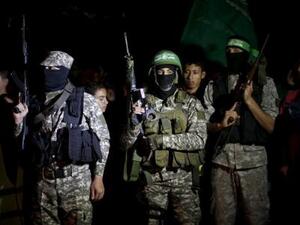 مسلحون من حماس أثناء مسيرة في مدينة غزة
