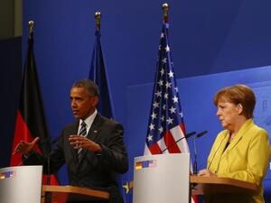 أوباما وبجوراه المستشارة الألمانية أنجيلا ميركل في هانوفر
