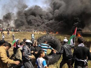 Tires being burned in Gaza (AFP/MAHMUD HAMS)