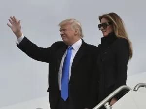 US President Donald Trump and his wife Melania step off a plane upon arrival at Andrews Air Force Base in Maryland on January 19, 2017. (AFP/ Mandel Ngan)