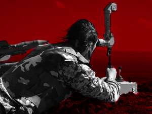 A soldier looks onto the battlefield in southern Syria, 2015 (Ramy Khoury/Al Bawaba)