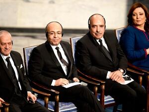 Tunisian National Dialogue Quartet member, Abdessatar Ben Moussa (R) receives the 2015 Nobel Prize medal as fellow Dialogue Quartet members, Houcine Abbassi (L) and Mohamed Fadhel Mahfoudh (2nd L) look on at the ceremony in Oslo on December 10, 2015. (AFP/Odd Andersen)