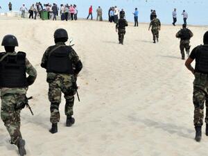 Tunisian security forces inspect a beach after a failed suicide bomb attack near the four-star Riadh Palms hotel, in the resort town of Sousse, on Oct. 30, 2013. (AFP/File)