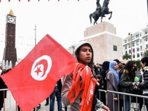  Tunisian boy holding a national flag (AFP/File Photo)