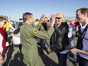 Virgin Galactic's Richard Branson and pilot Mark Stucky celebrating the successful flight of SpaceShip2 under rocket power, its first ever since the program began in 2005. (AFP/Mark Greenberg)