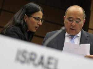 Israel's Ambassador to the IAEA prepares commentary during the meeting. The resolution to ensure Israel complies with IAEA oversight was narrowly defeated Friday (AFP)