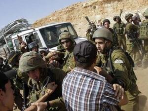 French diplomat Marion Fesneau-Castaing on the ground among Israeli soldiers in last week's scuffle in the West Bank (Courtesy of Abed Omar Qusini/Reuters)