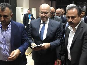 Newly elected Iraqi President Kurdish Barham Saleh (C) walks at the parliament in Baghdad on October 2, 2018. Karim AMMAR / AFP
