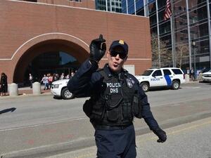 Police evacuate the area around the Boston courthouse after a bomb (AFP/ Stan Honda)