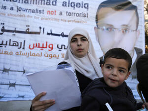 Mohammed al-Qiq's wife, Fayha Shalash and her son Islam, on 31 January, 2016  (AFP/File)