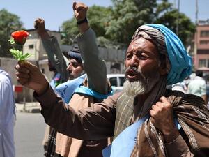 An Afghan peace activist arriving in Kabul on June 18 after marching from hundreds of kilometres from Helmand province, shouts a slogan demanding an end to the war. (Wakil Kohsar / AFP)