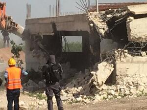 Israeli bulldozers demolished building in Palestinian (Twitter)