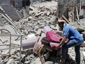 Sorting through rubble caused by Saudi-led coalition airstrikes in Aden. (AFP/Saleh Al Obeidi) Sorting through rubble caused by Saudi-led coalition airstrikes in Aden. (AFP/Saleh Al Obeidi)