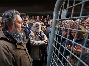 Police have detained Cumhuriyet's editor-in-chief Murat Sabuncu (L) and are hunting for the executive board chairman. (AFP/Ugur Demir)