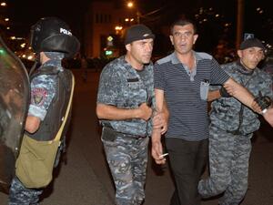 Armenian police detain opposition supporters blocking a street leading to Erebuni police station seized by gunmen - supporters of fringe jailed opposition leader Zhirair Sefilyan - in Yerevan late on July 29, 2016. (AFP/Karen Minasyan)