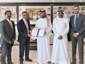 Ahmed Fawzi Kanoo, Director at YBA Kanoo Group in center with YBA Kanoo’s IT team