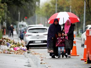 Members of the Muslim community arrive for Friday prayers (AFP)