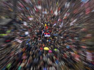Thousands of people from all over Serbia gathering in front of the National Assembly building in central Belgrade to protest against Serbian President and to demand free media and fair elections (AFP)
