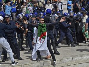 An Algerian protester reacts during an anti-government demonstration  (AFP)
