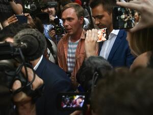 Russian investigative journalist Ivan Golunov (C), charged of 'illegal production or sale of drugs', leaves Russian Head Investigative Department's office in Moscow  (AFP)