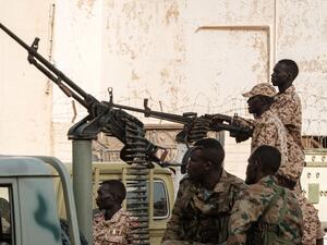 A member of Sudan's Rapid Support Forces (RSF) paramilitaries mans a machine gun turret while on guard outside the offices of the anti-corruption prosecution in the capital Khartoum (AFP)