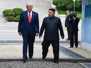 North Korea's leader Kim Jong Un and US President Donald Trump cross south of the Military Demarcation Line that divides North and South Korea, after Trump briefly stepped over to the northern side, in the Joint Security Area (JSA) of Panmunjom in the Demilitarized zone (DMZ) on June 30, 2019.  Brendan Smialowski / AFP
