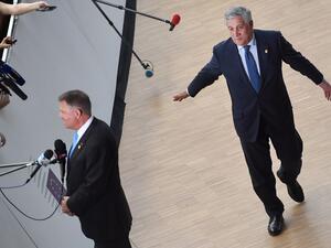 European Parliament President Antonio Tajani arrives as Romania's President Klaus Werner Iohannis (L) speaks to the press prior to an European Council Summit at The Europa Building in Brussels (AFP)