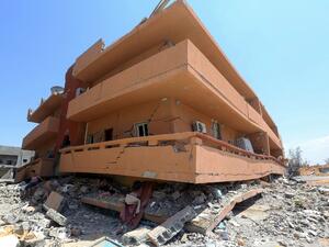 A partially demolished building located near the Yarmouk military compound, controlled by the Libyan Government of National Accord (GNA) forces (AFP)