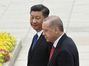 Turkish President Recep Tayyip Erdogan (R) and Chinese President Xi Jinping (L) inspect Chinese honour guards during a welcome ceremony outside the Great Hall of the People in Beijing on July 2, 2019.  WANG ZHAO / AFP