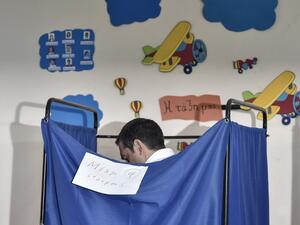Greek Prime Minister Alexis Tsipras stands in a voting booth at a polling station during general elections in Athens, on July 7, 2019. Greek voters are casting their ballots in the country's first national election of the post-bailout era. Louisa GOULIAMAKI / AFP