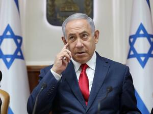 Israeli Prime Minister Benjamin Netanyahu rubs his face as he chairs the weekly cabinet meeting at his office in Jerusalem on July 7, 2019.  ABIR SULTAN / POOL / AFP