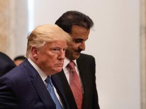 US President Donald Trump and Sheikh Tamim bin Hamad al-Thani, Emir of Quatar, take their seats at a dinner at the Treasury Department in Washington, DC, on July 8, 2019.  NICHOLAS KAMM / AFP