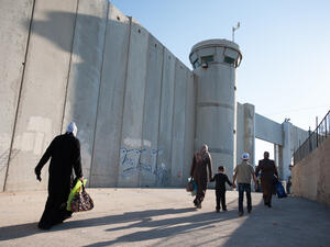 Palestinian women pass through the Bethlehem checkpoint (Shutterstock)	
