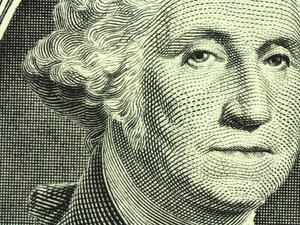 New one dollar bill closeup (Shutterstock)