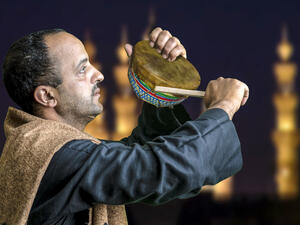 Wake up man calling sleeping people to wake up for sohour in Egypt (Shutterstock)	