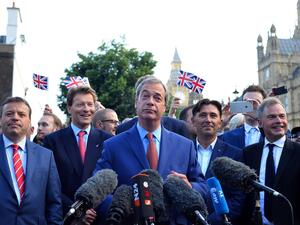 Nigel Farage has been pictured filming refugees entering the UK /AFP