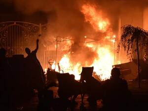 Supporters of the former Kyrgyzstan president Almazbek Atambayev clash with special forces outside his home. Photograph: Vyacheslav /AFP