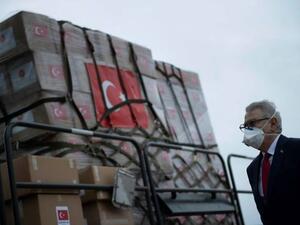 Turkey’s US, Ambassador Serdar Kilic watches as medical supplies arrive in the US in April /AFP