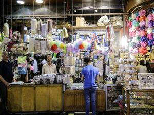 A merchant in al-Hamidiyah Souq /AFP