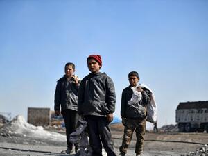 In Pictures: Syrian Children Work at Oil Refinery to Get By